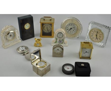 A quartz desk timepiece, the case in the form of a wrapped package, W. 5.5cm, together with eleven further desk and mantle ti
