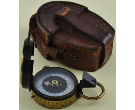 A First World War dry card compass by Cary, the lacquer brass case with mother of pearl scale, MK VII, tan leather cased