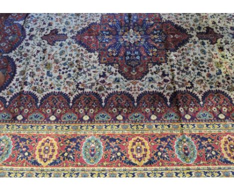 A Persian style ivory ground carpet, 285 x 200cm