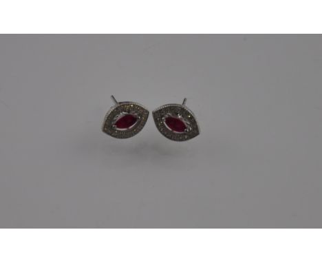 A pair of silver cubic zirconium and simulated ruby earrings