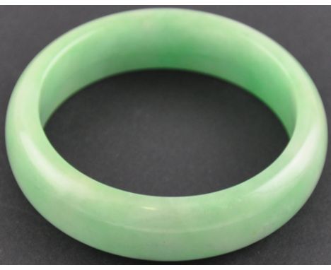 A Chinese jade bangle.