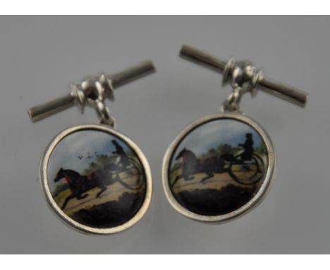 A pair of circular silver chain and bar cufflinks, decorated with scenes of a horse and trap
