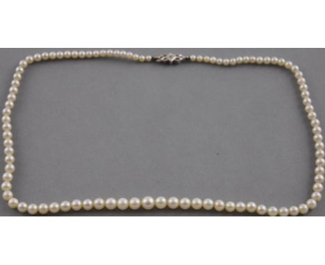 A graduated cultured pearl necklace with 9ct white gold and diamond set clasp