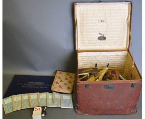 An early 20th century large square steamer trunk, containing a quantity of books, games and juvenalia, (qty) 
