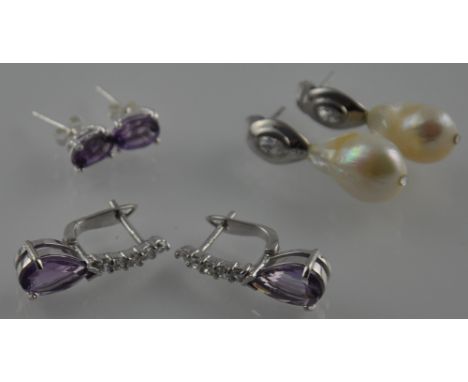 Three pairs of silver earrings, amethyst drops, amethyst studs, and pearl drops