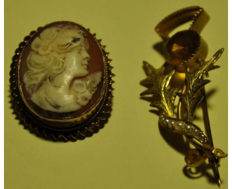 A 15ct yellow gold citrine and seed pearl thistle shaped brooch together with a Victorian carved cameo and yellow metal brooc