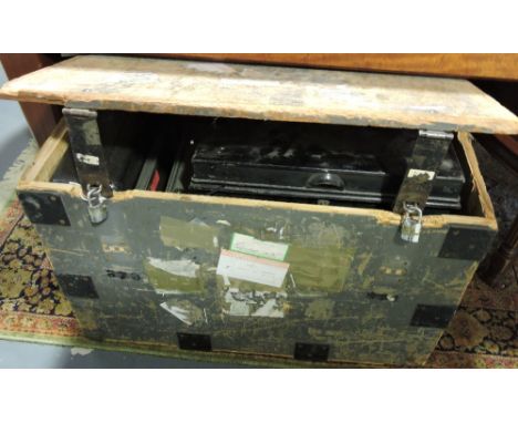 A metal bound wooden trunk containing assorted metal document boxes
