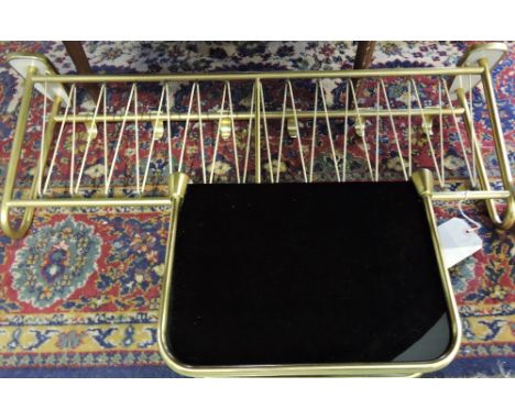 A 1950's tubular gilt metal hanging coat rack, together with a matching wall shelf