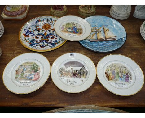 Four Royal Worcester Christmas series plates and two Portuguese chargers.