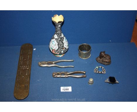 A quantity of miscellanea including enamelled copper Persian vase, white metal napkin ring, nutcrackers, thimble, costume bro