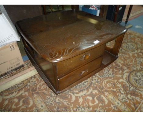 An Ercol dark Elm Coffee Table with lower shelf and two drawers. 32'' x 32'' x 15 1/2'' high.