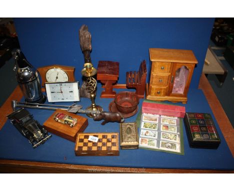 A quantity of Treen including clocks, jewellery boxes, a brass candlestick, a soda siphon, etc.,