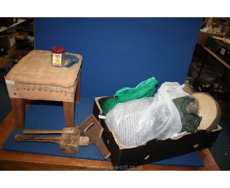 An apprentice upholsterer's Stool with tools, horsehair, webbing, nails, etc.