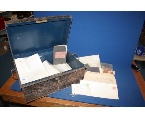 An old metal trunk with key filled with old newspapers including the Cambridge Chronicle dated 1836, Eastern Evening News 190