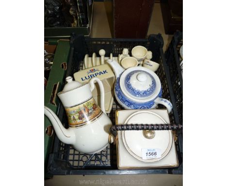 A quantity of china including Lurpak toast rack, butter dish, three egg cups, blue and white teapot etc.