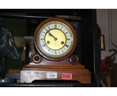 A Mahogany and Satinwood mantel Clock, the movement fitted in a cylindrical case supported on two sub cylindrical supports on