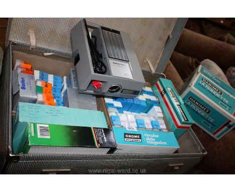 A Hanimex La Rondette 35mm colour slide projector in box together with a suitcase of slides and negatives.