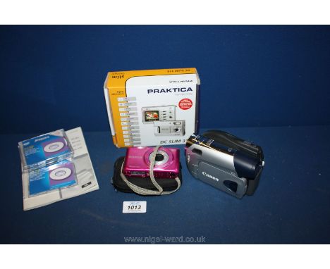 A Canon DC301 DVD R/RW digital video Camera with battery, instructions and disks together with a Fujifilm 16 mega pixel compa