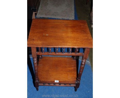 An Edwardian rectangular Mahogany occasional Table standing on turned legs and with bobbin-turned detail frieze to the top an