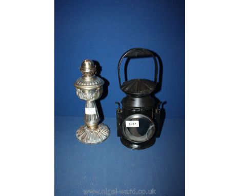 A brass oil lamp base and a Victorian railway lamp.