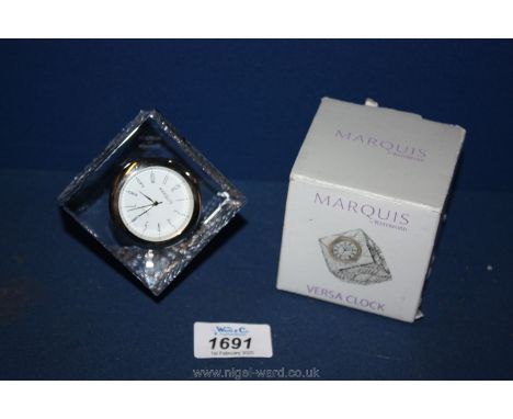 A small Marquis by Waterford Versa clock, boxed.
