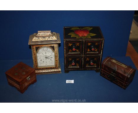 A mantle clock, a small four-drawer hand-painted cabinet, a chest money box and a small engraved box.
