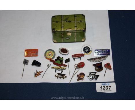 A miniature novelty tin trunk and a quantity of badges and lapel pins including R.A.C., J.C.B., Yamaha, VW, Pitt Trailers, et