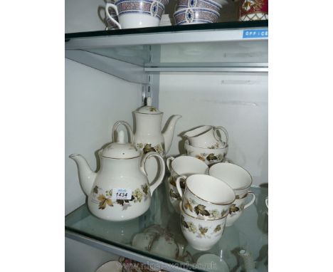 A Royal Doulton Larchmont tea service to include six cups and saucers, six side plates, teapot, coffee pot, milk jug and suga