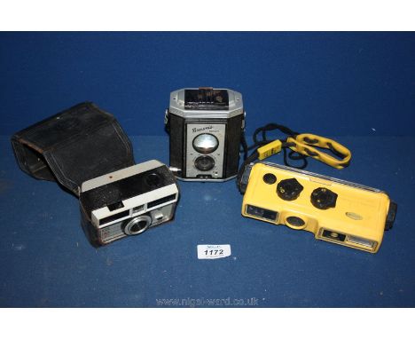Three Cameras including Minolta Weathermatic and Brownie Reflex.
