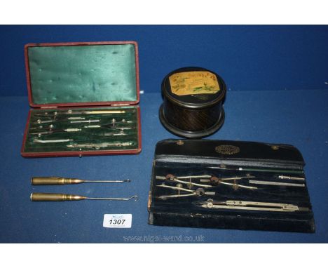 Two cased sets of drawing instruments including one marked "A.J Thornton, Manchester", two button hooks with shell case handl
