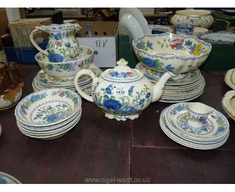 A quantity of blue/cream Masons dinner service to include seven large plates, eight salad plates, three side plates, three sa