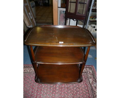 A dark-stained Elm three-tier Ercol type tea Trolley. 28'' x 18'' x 30 1/4'' high.