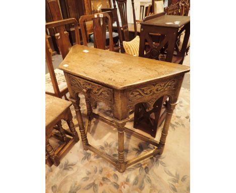 Priory style oak single drawer console table and a nest of three graduated oak occasional tables 