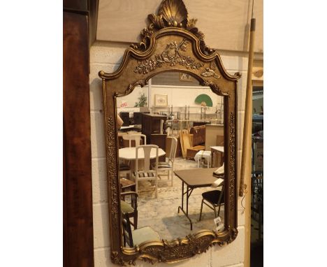 Large reproduction revival style mirror with gilt wood frame decorated with birds flowers and a shell 