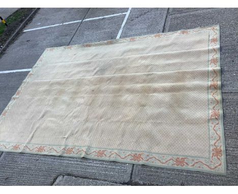 Large English carpet, with salmon ground and allover geometric ornament in ribbon border, approximately 510 x 370cm.Provenanc