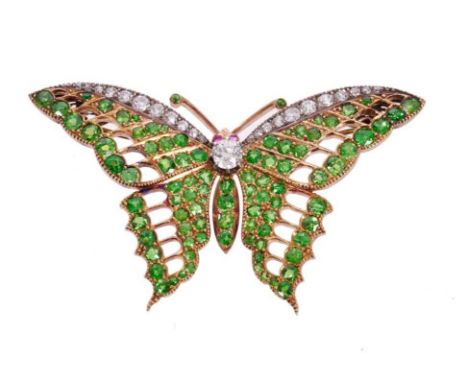 Fine Edwardian Belle Époque diamond, ruby and demantoid green garnet butterfly brooch with cabochon ruby eyes, the body and w