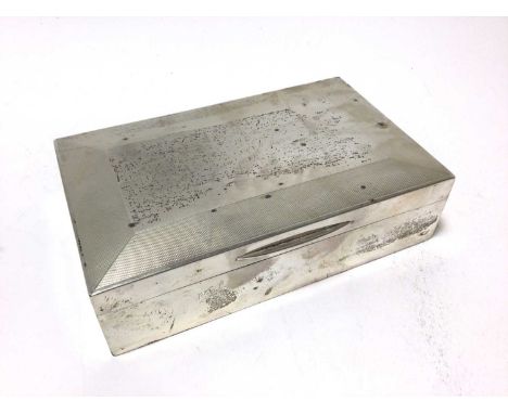 1930s silver cigarette box of rectangular form, with hinged cover and engine turned decoration (London 1934). P B Ld. 16.5cm 