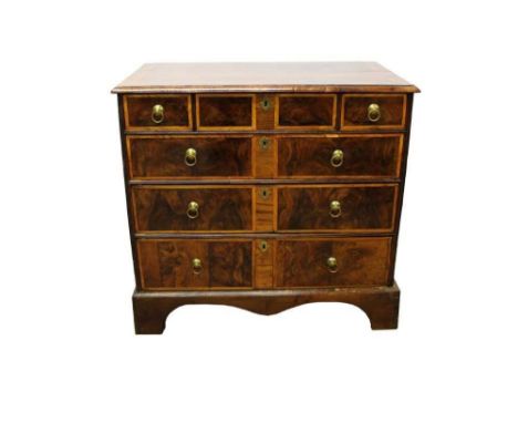 Early 18th century walnut and elm banded chest, having three short over three long graduated drawers on bracket feet, 92cm wi