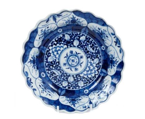 A Worcester plate, circa 1770, painted in blue with the Kangxi Lotus pattern, pseudo-Kangxi mark to base, 19cm diameterCondit