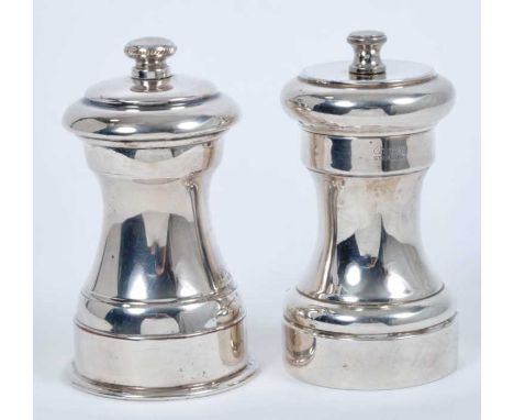 Contemporary sterling silver capstan pepper grinder, marked Cartier Sterling, together with another silver plated capstan pep