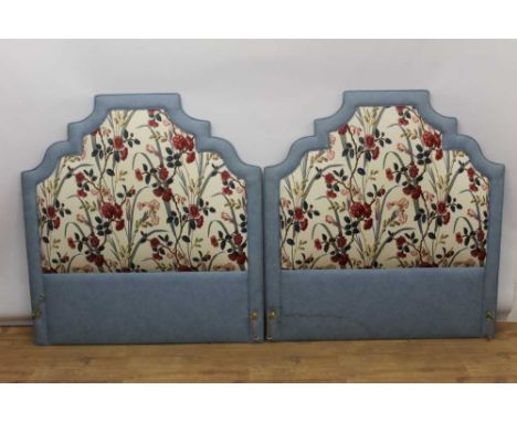 Pair of red, blue and off-white floral upholstered bed heads of stepped arched form, together with pair of matching interline