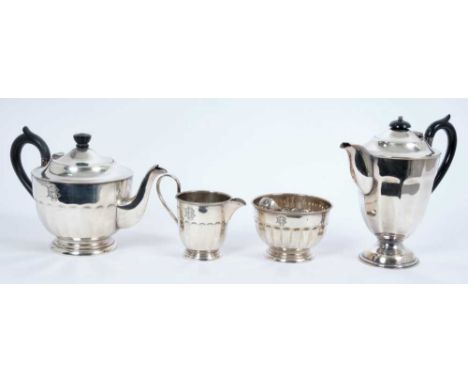 1930s silver three piece tea set comprising, teapot of half fluted form with bead border and engraved monogram, ebony loop ha