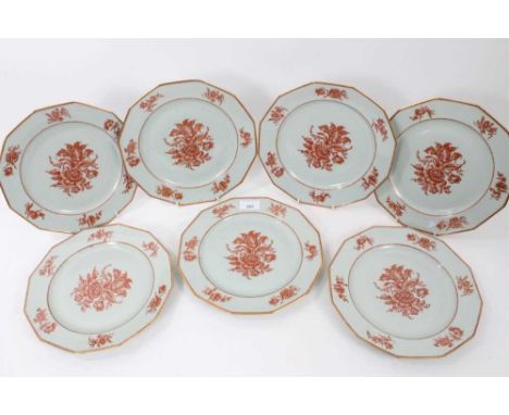 Seventeen modern Limoges dinner plates, hand painted in red enamel and gilt with a floral pattern, 25cm diameterProvenance: T
