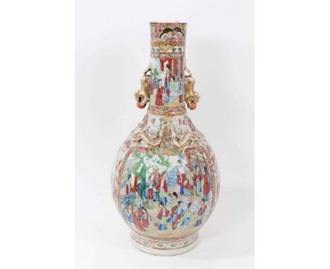 Large Chinese famille rose bottle vase, 19th century, decorated in the Canton style, with moulded foo dogs and dragons, 45cm 