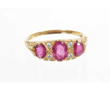 Victorian style ruby and diamond ring with three oval mixed cut rubies interspaced by four brilliant cut diamonds in gold car