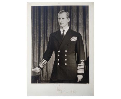 H.R.H. The Duke of Edinburgh signed presentation portrait photograph of the Duke in Naval uniform signed in ink on mount 'Phi