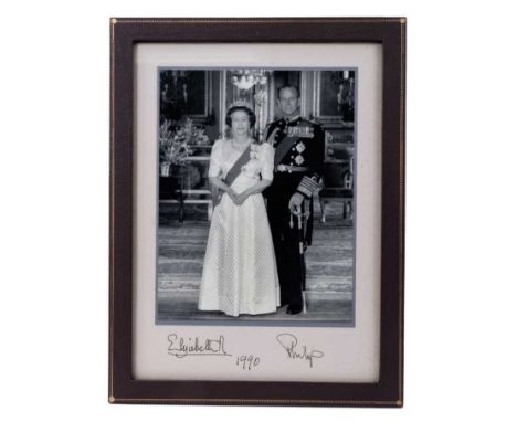 H.M. Queen Elizabeth II and H.R.H.The Duke of Edinburgh - signed 1990 presentation portrait photograph of the Royal couple at
