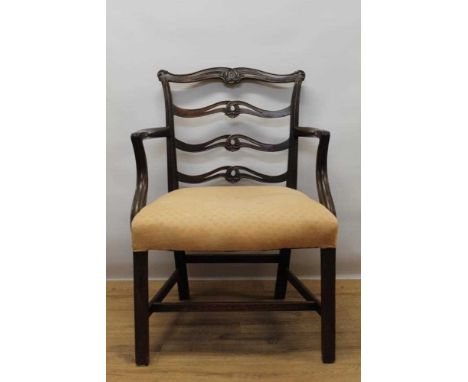 George III mahogany elbow chair, pierced ladder back and stuffover seat on square tapered legs and H-stretcher