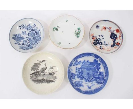 A Lowestoft saucer, a Worcester saucer and three other saucers
