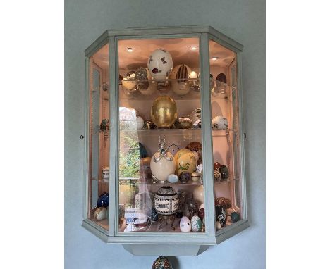 Impressive pair of painted hanging display cabinets, each with hexagonal front and twin side doors enclosing perspex shelves,